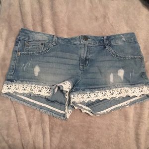 Denim shorts with lace around pant leg
